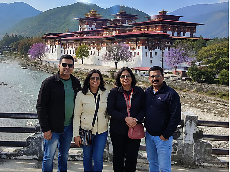 Four Ayansh Holidays travellers in front of Punakha Dzong, Bhutan